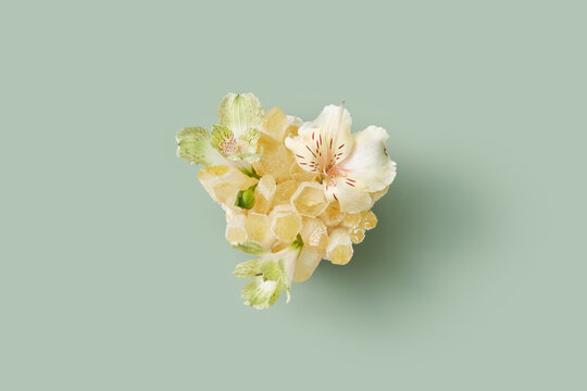 Spring flowers lying on orange healing crystal