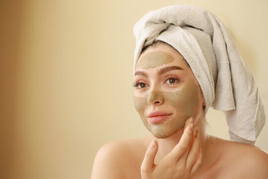 young woman applying facemask