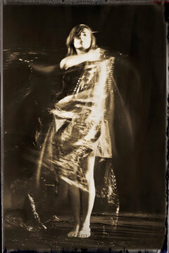 Woman covered in glitter dress