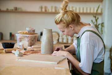 Woman ceramist in her workshop