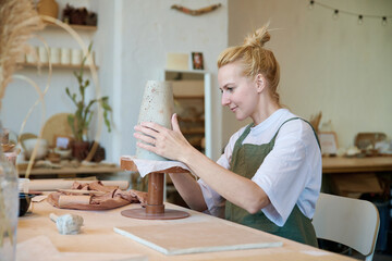 Young ceramist makes handmade vases