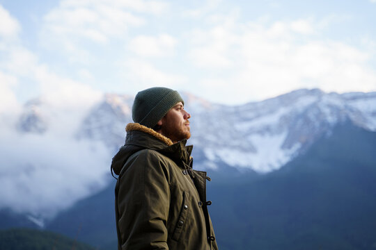 Portrait of happy meditative man in the mountain