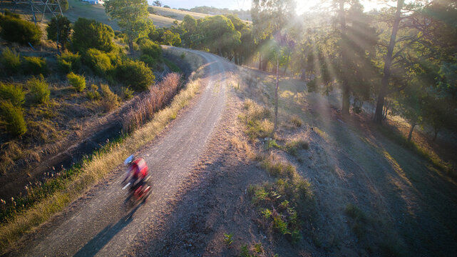 Lone Mountain Bike Rider on a Rural Track Speeding Past.