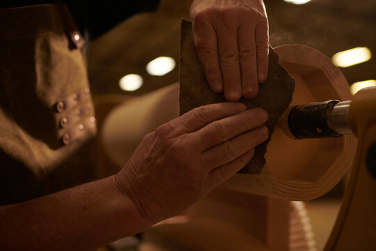 Carpenter using a Sanding Machine