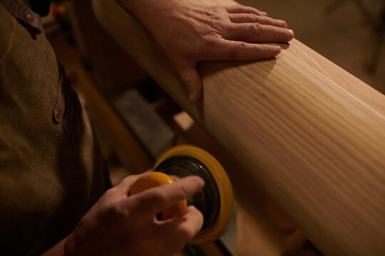 Carpenter using a Sanding Machine