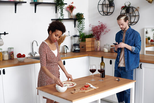 Friends decided to drink wine in the kitchen