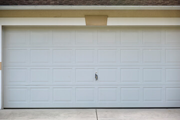 Wide garage double door and concrete driveway of new modern american house