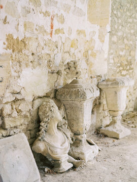 Antique Statues Near A Wall
