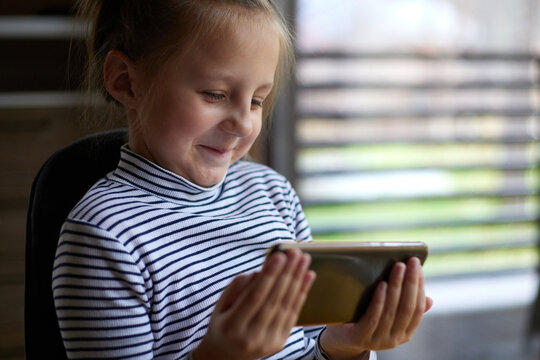 Portrait of a child with a smartphone
