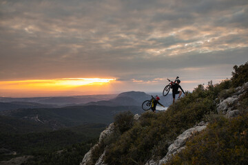 Mountain bikers at sunset