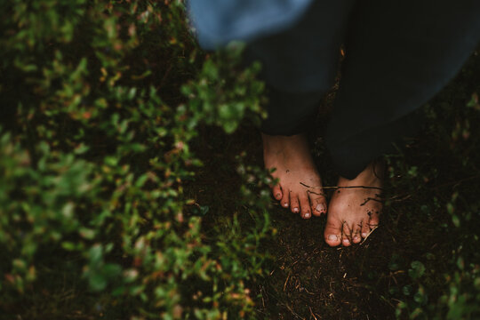 Barefoot girl walks on mountain trails