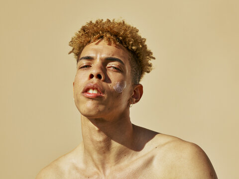 Confident young men show us some attitude -  earth skin tones color 