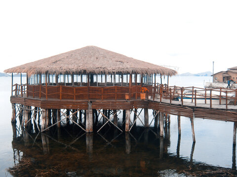 Lake Titicaca altiplano bolivia, highest lake in the world, chosa totora water customs rustic yesteryear boat background