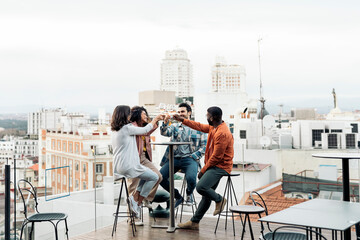 Group of friends having fun on rooftop