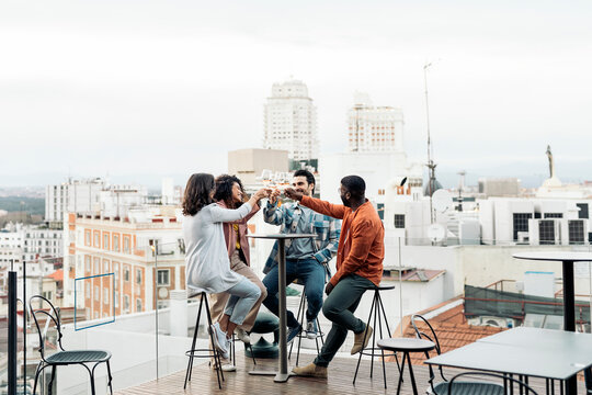 Group of friends having fun on rooftop