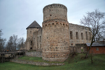 Fototapeta na wymiar Cloudy November day at the medieval castle of the Livonian Knights Order. Cesis, Latvia