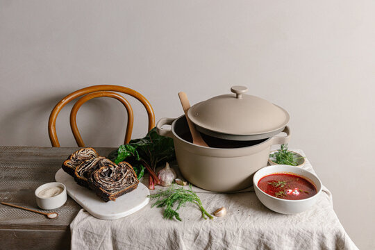 Chocolate babka and borscht on dining table