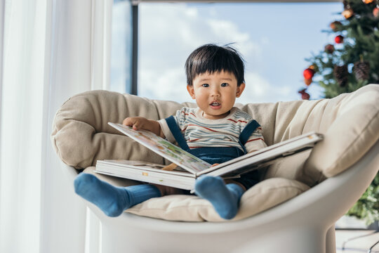little baby boy reading