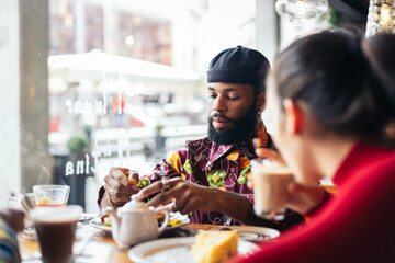 Friends having breakfast in a coffee shop