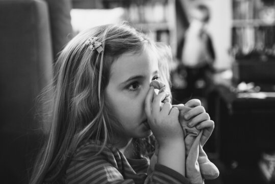 Little girl sucking her thumb
