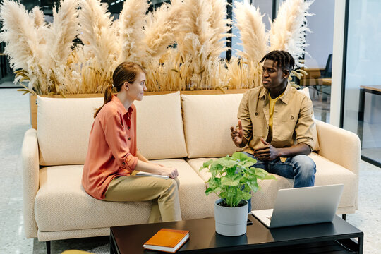 Colleagues resolving work issues in coworking space