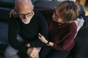 Older couple having difficult conversation.
