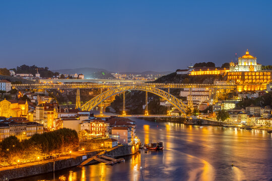 The river Douro and the famous iron bridge in Porto at night