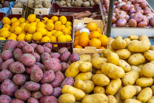 Potatoes and lemons for sale at a market