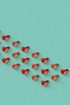 rows of pink screws on a blue background