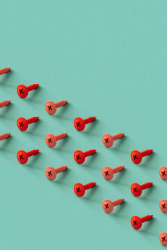 rows of pink screws on a blue background