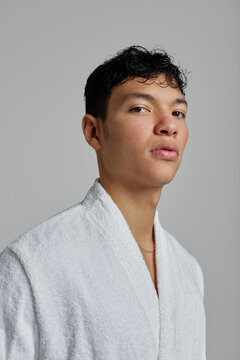 Man with bath robe in studio
