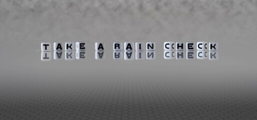 take a rain check word or concept represented by black and white letter cubes on a grey horizon...