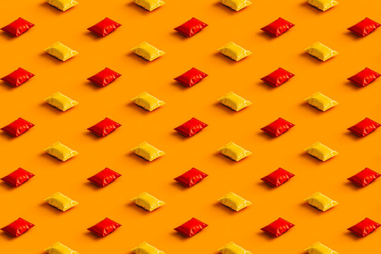 pattern of orange and red chips packages with no label.