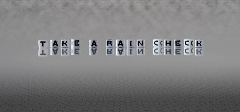 take a rain check word or concept represented by black and white letter cubes on a grey horizon background stretching to infinity