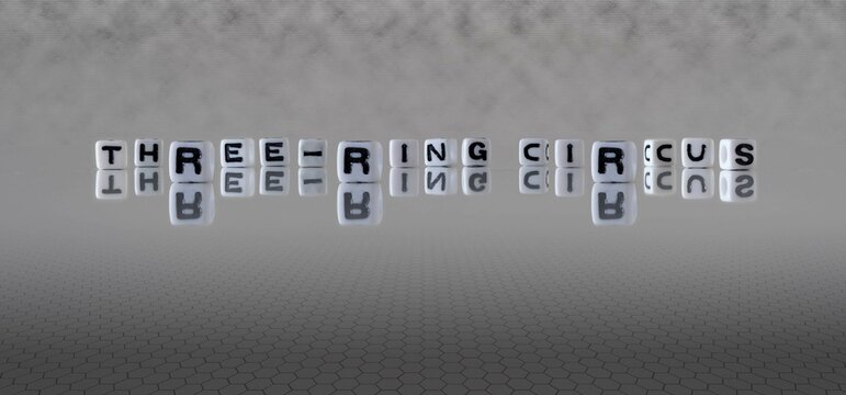 Three Ring Circus Word Or Concept Represented By Black And White Letter Cubes On A Grey Horizon Background Stretching To Infinity