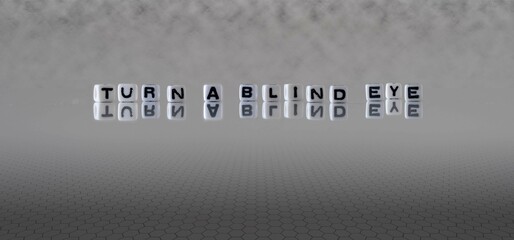 turn a blind eye word or concept represented by black and white letter cubes on a grey horizon...