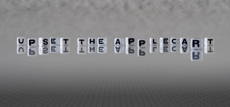 upset the applecart word or concept represented by black and white letter cubes on a grey horizon background stretching to infinity