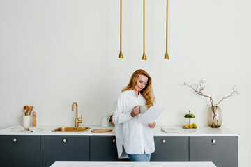 Businesswoman having breakfast in morning at home