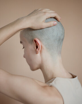 Young woman after shaving her head
