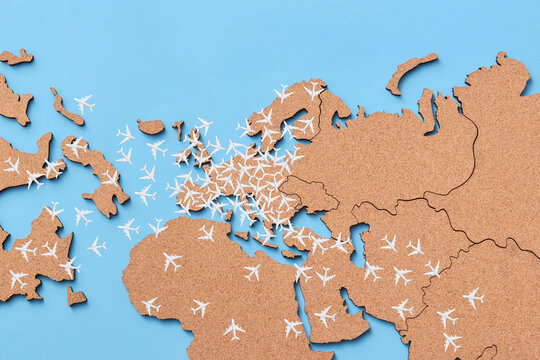 Models Of White Airplanes Over Brown World Map