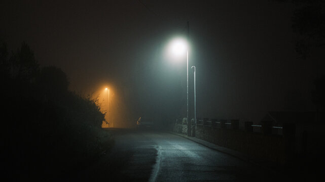 Empty road a misty night