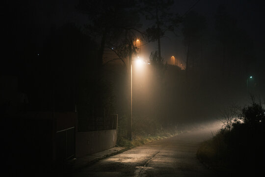 Empty road a misty night