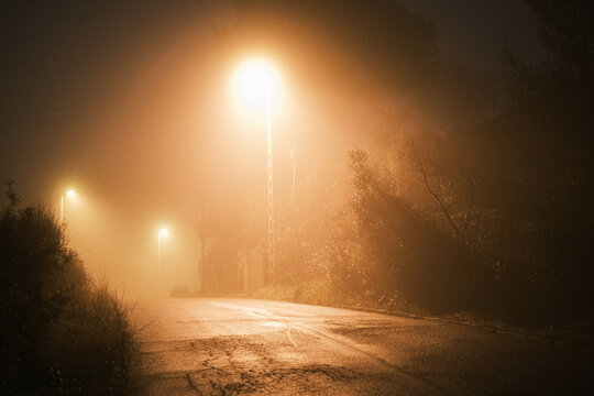 Empty road a misty night