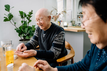 Senior couple taking medicines