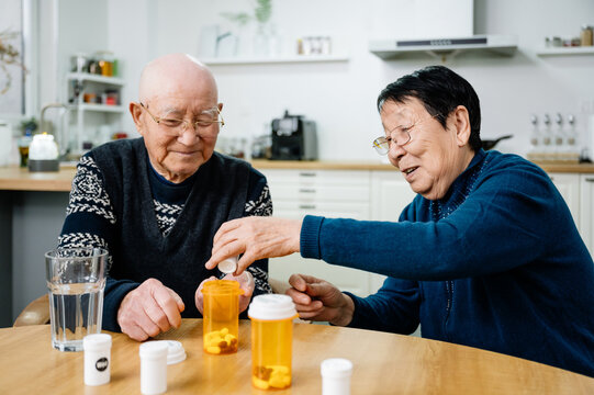 Senior couple taking medicines