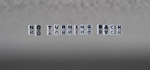 no turning back word or concept represented by black and white letter cubes on a grey horizon...