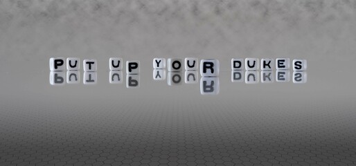 put up your dukes word or concept represented by black and white letter cubes on a grey horizon background stretching to infinity