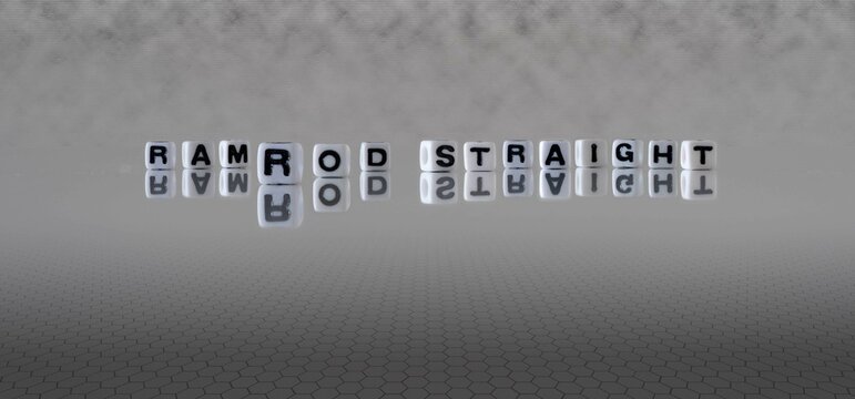 ramrod straight word or concept represented by black and white letter cubes on a grey horizon background stretching to infinity