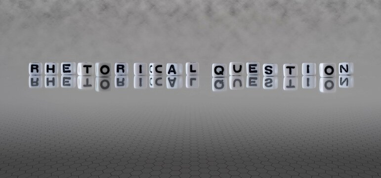 rhetorical question word or concept represented by black and white letter cubes on a grey horizon background stretching to infinity