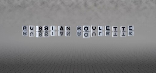 russian roulette word or concept represented by black and white letter cubes on a grey horizon background stretching to infinity